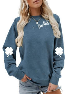 Detail of clover print on sleeves and Lucky text on blue long sleeve sweatshirt