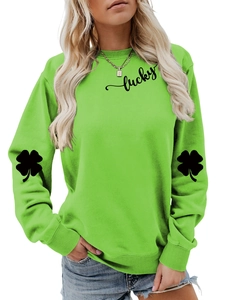 Detail of the black lucky text and clover prints on the bright green long sleeve sweatshirt