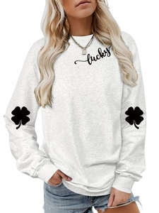 Close-up of black clover print on sleeve and lucky text on white cotton sweatshirt