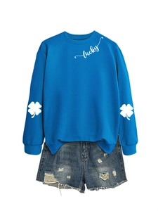 Detail view of lucky four-leaf clover sleeve print on casual bright blue sweatshirt