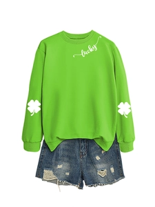 Detail of clover print on green long sleeves and lucky lettering on sweatshirt