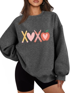 Close-up of the creative XOXO graphic print on a dark grey sweatshirt for women