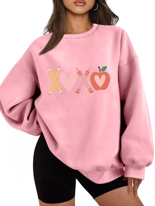 Pink crewneck sweatshirt featuring a creative XOXO graphic with teacher themed icons