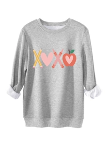 Detail of grey sweatshirt with XOXO print and thick fleece lining on the cuffs