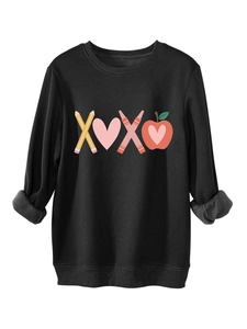Detail showing the gray fleece lining and artistic XOXO graphic on the black sweatshirt