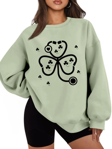 Detail of light green sweatshirt with stethoscope clover print and ribbed crew neck