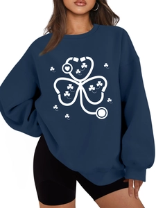 Detail of stethoscope and clover print on navy blue thick sweatshirt for women