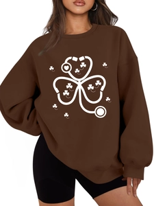 Detail of shamrock stethoscope print on warm dark brown fleece crewneck sweatshirt