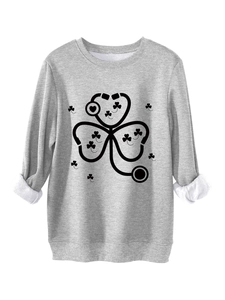 Detail of the fleece lining and stethoscope clover print on this grey sweatshirt