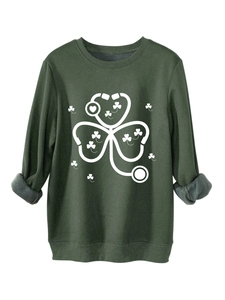 Detail of dark green sweatshirt featuring white clover stethoscope print and fleece lining