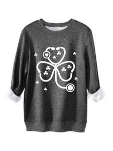 Detail of stethoscope clover print on dark gray fleece sweatshirt with ribbed cuffs