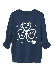Close-up of navy crewneck sweatshirt featuring white clover and stethoscope heart graphic