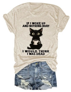Detail of funny quote and cartoon cat graphic on beige cotton blend t-shirt