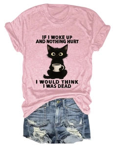 Detail of pink cotton T-shirt with cat print paired with distressed denim shorts