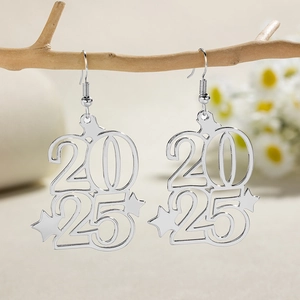 Bohemian 2025 hollow star stainless steel earrings displayed on a natural branch