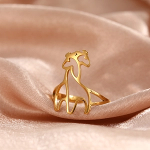 Minimalist gold giraffe open ring in hollow geometric design on silk background