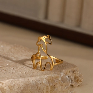 Minimalist geometric hollow giraffe open ring in gold finish on natural stone
