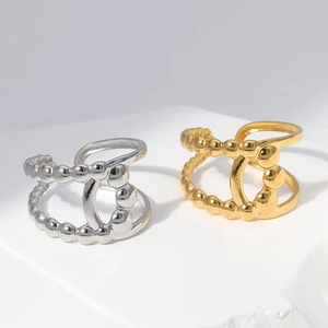 Minimalist double-layered gold and silver stainless steel rings with beaded edges and polished finish