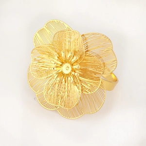 Golden hollow floral napkin ring with layered 3D petal design for wedding table decor