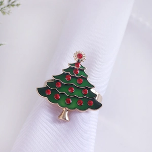 Christmas tree napkin ring with red rhinestones and green enamel on a golden base