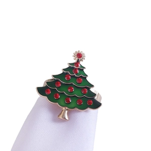 Christmas tree napkin ring with green enamel and red rhinestones on golden base