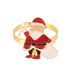 Christmas napkin ring featuring a gold Santa Claus motif with colorful enamel detailing