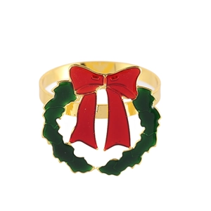 Christmas napkin ring with green wreath, red bow, and gold finish for table setting