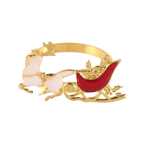 Festive gold metal napkin ring with red sleigh and white reindeer design for holiday table decor