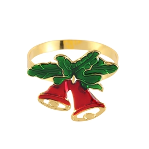 Detail of a gold metal Christmas napkin ring featuring red bells and green holly leaves