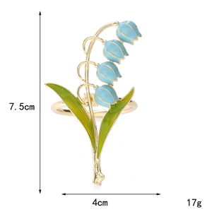 Vintage lily of the valley napkin ring in gold metal with blue enamel flower and green leaves