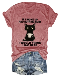 Flat lay of red cotton tee with cat print and distressed denim shorts ensemble