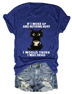 Flat lay of navy blue cotton t-shirt with funny cat print and ripped denim shorts