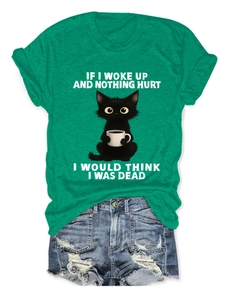 Detail of green cotton t-shirt with funny cat print and distressed denim shorts