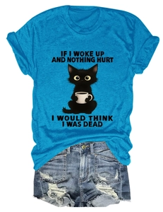 Flat lay of blue cat graphic T-shirt paired with distressed denim shorts set