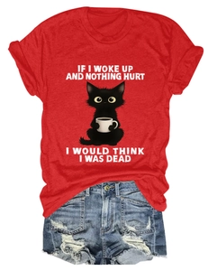 Detail of red cotton T-shirt featuring cartoon cat graphic and funny English slogan