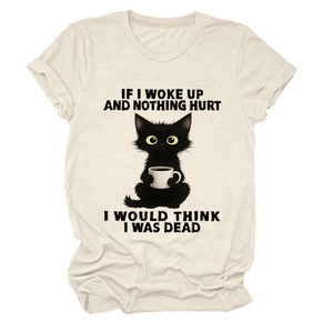 Close-up of funny black cat print and quote on beige cotton short sleeve T-shirt