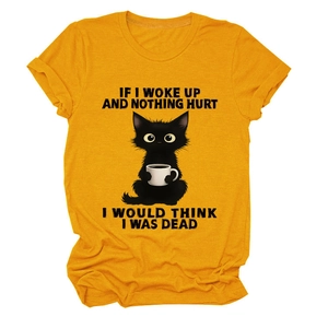 Detail of ginger yellow cotton T-shirt featuring a vintage black cat and coffee print