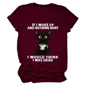 Close-up of burgundy cotton T-shirt featuring a funny black cat and slogan print