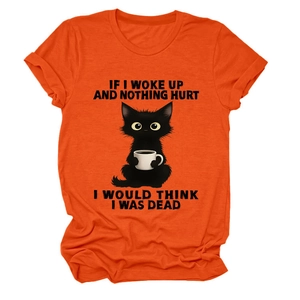 Detail of funny black cat print with text on vibrant orange cotton crew neck t-shirt