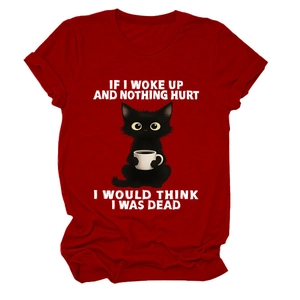Detail of red crew neck t-shirt featuring a cartoon cat and funny quote graphic