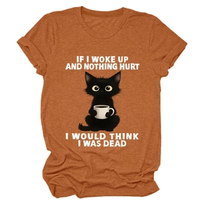 Close-up of rust red cotton t-shirt featuring a funny black cat drinking coffee print