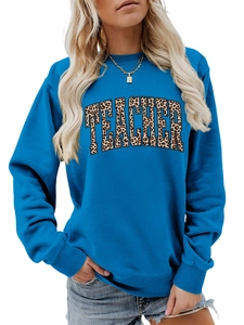Detailed view of teacher leopard print letters on comfortable blue crewneck sweatshirt