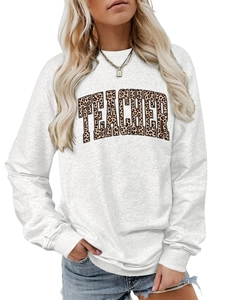 Detail of grey sweatshirt showing the leopard print teacher text and cotton fabric