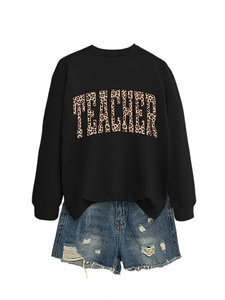 Detail of Teacher leopard print sweatshirt with distressed denim shorts on white background