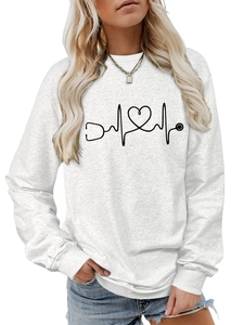 Detail of creative stethoscope heart medical graphic on white crewneck sweatshirt