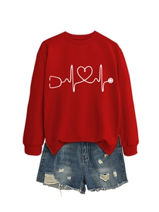 Flat lay of red sweatshirt with stethoscope heart print and washed blue denim shorts