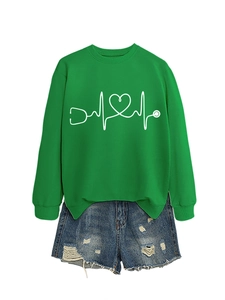 Detail of green crewneck sweatshirt featuring creative stethoscope and heart graphic design