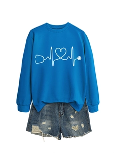 Detail of blue sweatshirt featuring white stethoscope and heart pattern with ribbed cuffs