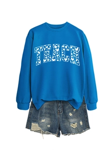 Blue crewneck sweatshirt with TEACH heart print and distressed denim shorts