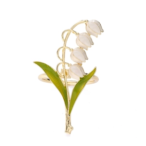 Elegant lily of the valley metal napkin ring with white enamel flowers and green leaves